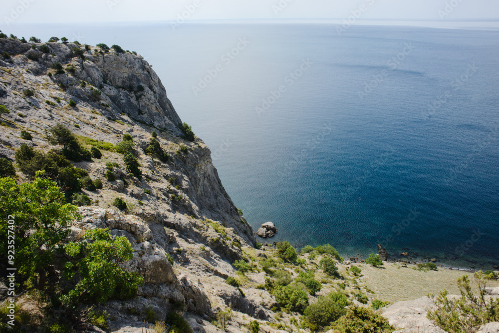 The landscape of the rocky coast of the Crimean Peninsula. Sea, sky and mountains The landscape of the rocky coast of the Crimean Peninsula. Sea, sky and mountains