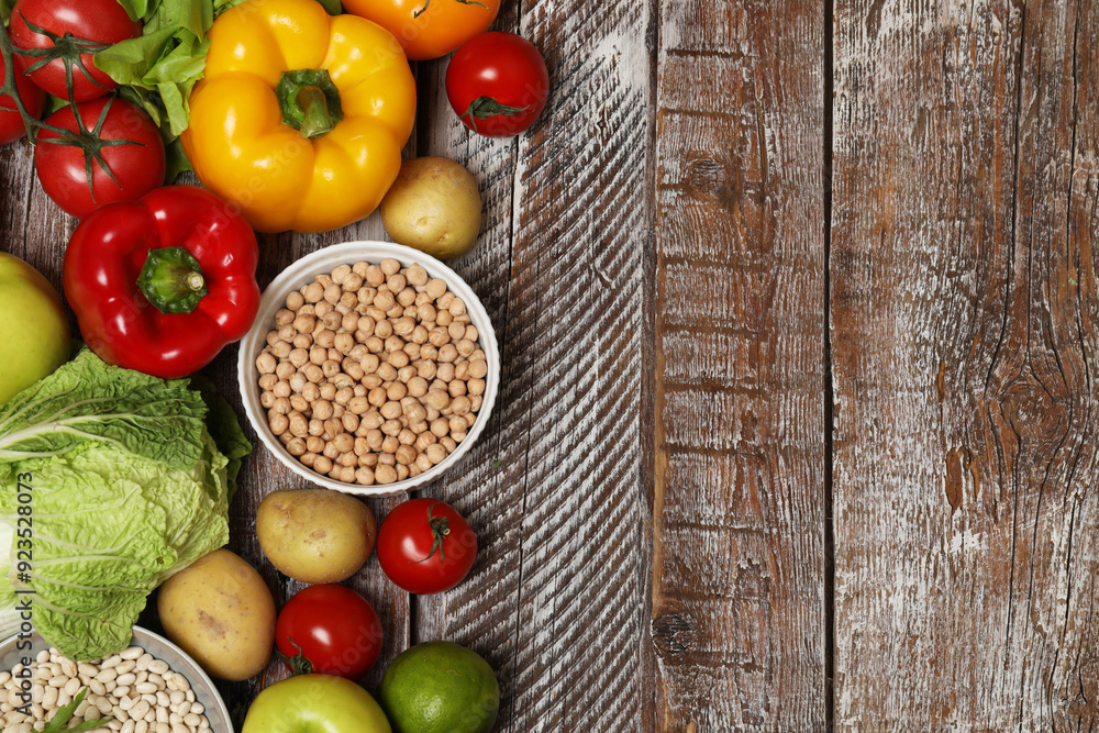 Different vegetarian products on wooden table, top view. Space for text Different vegetarian products on wooden table, top view. Space for text