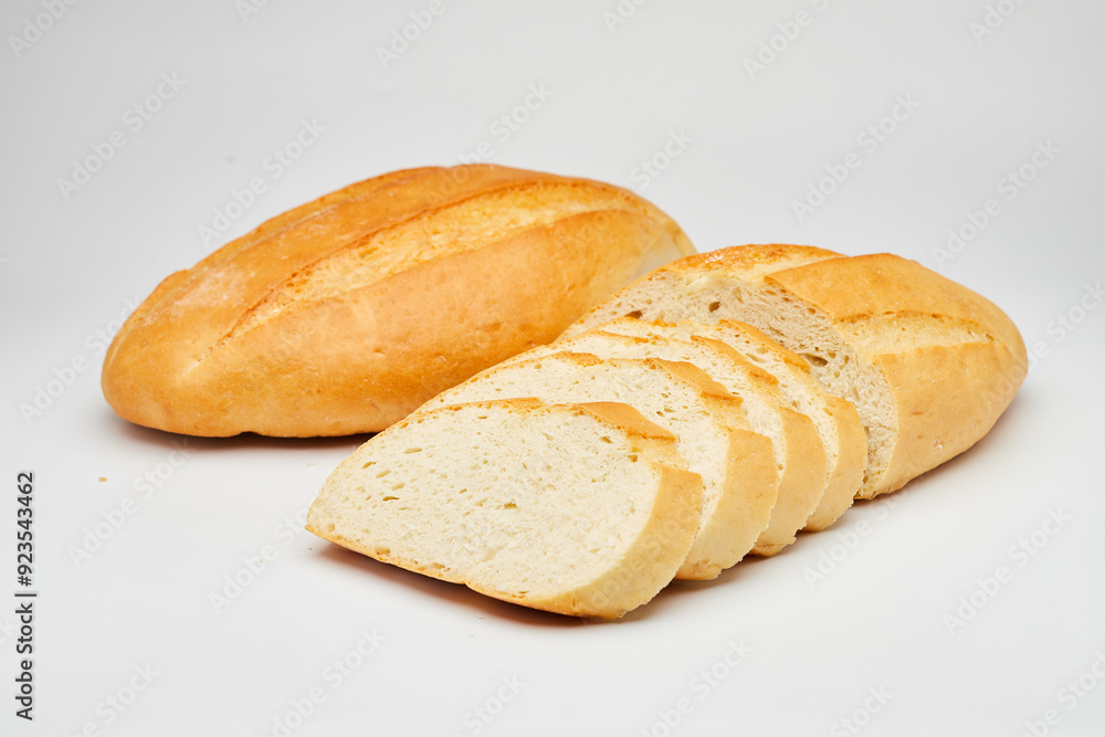 Freshly baked white bread loaf, sliced and ready to serve, perfect for sandwiches and breakfast Freshly baked white bread loaf, sliced and ready to serve, perfect for sandwiches and breakfast