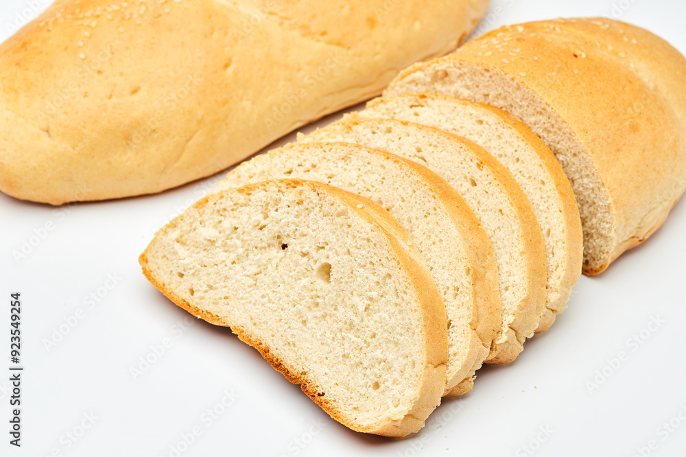 Freshly baked white bread loaf, sliced and ready to serve, perfect for sandwiches and breakfast Freshly baked white bread loaf, sliced and ready to serve, perfect for sandwiches and breakfast