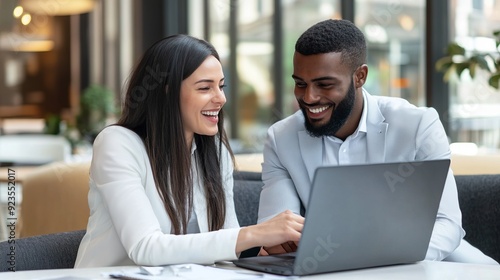 Colleagues Collaborating on Laptop