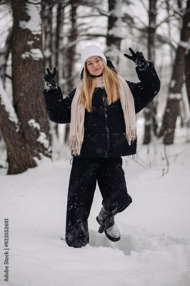 Funny teenage girl posing in the woods in winter. Funny teenage girl posing in the woods in winter.