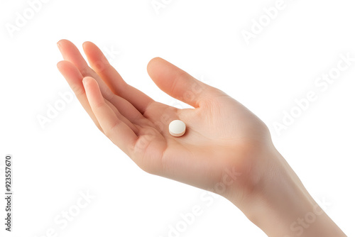 Single white capsule pill on the palm of a hand isolated on white background