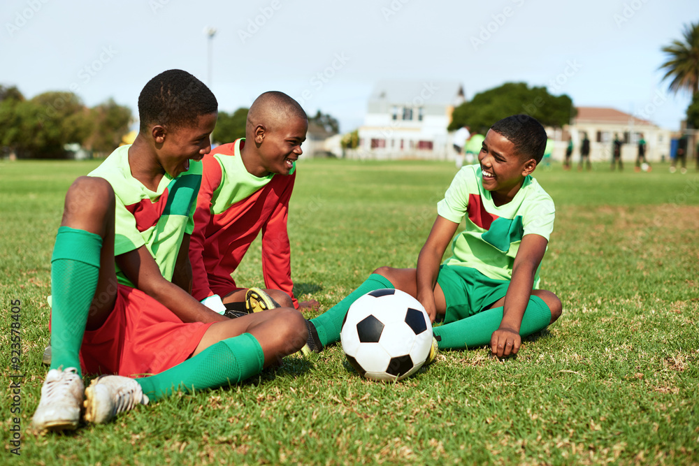 Happy boys, soccer and break with ball on grass field for sports, game or match together in nature. Group of young children, kids or team with smile for football, social or chat on outdoor pitch Happy boys, soccer and break with ball on grass field for sports, game or match together in nature. Group of young children, kids or team with smile for football, social or chat on outdoor pitch