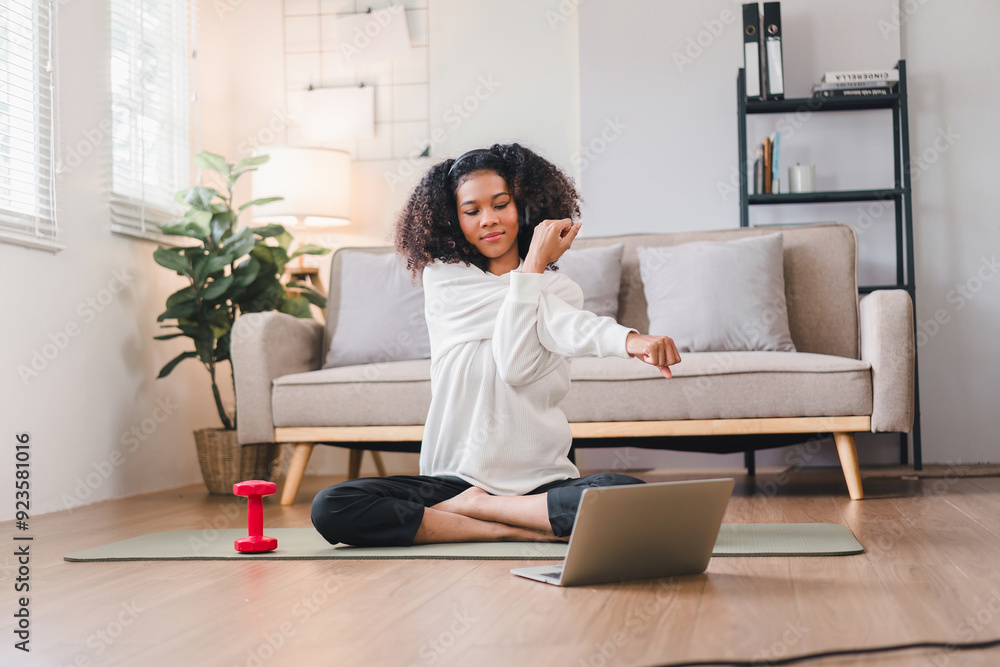 Happy African American Woman Stretching on Yoga Mat at Home. Happy African American Woman Stretching on Yoga Mat at Home.