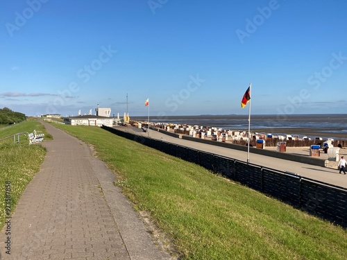 Strandpromenade und Radweg am Deich mit Blick auf die Nordsee in Cuxhaven  photo