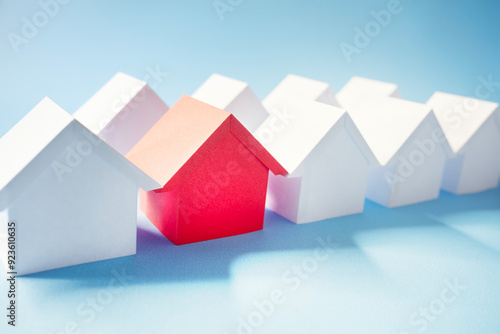 Searching for real estate property red paper house on blue background