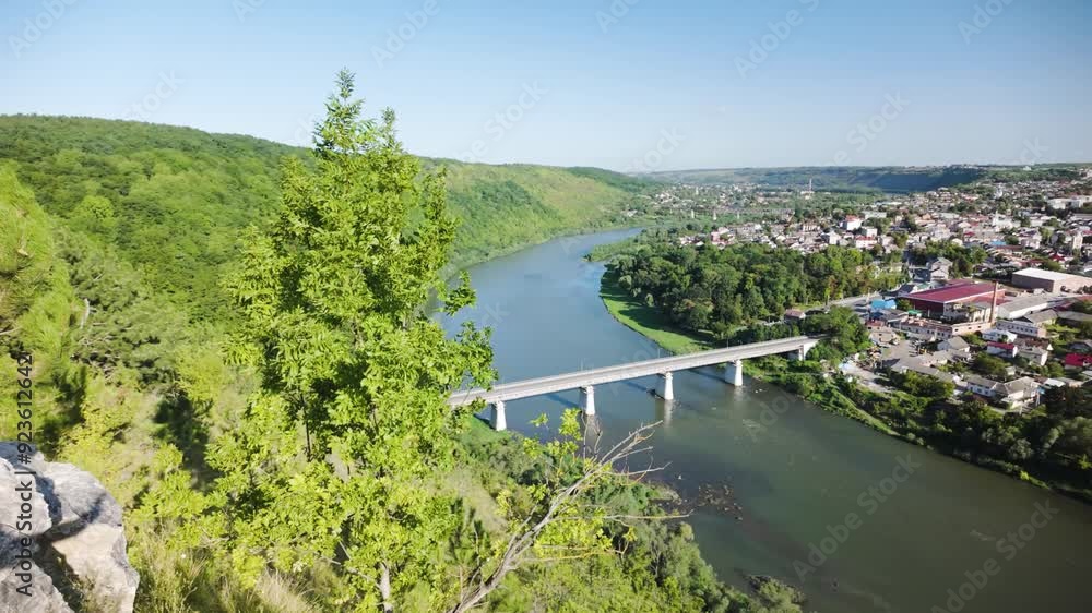 Ukraine, the meander of the Dniester around the city of Zalishchyky is picturesque and original, bridge, houses and road in the Chernivtsi region Ukraine, the meander of the Dniester around the city of Zalishchyky is picturesque and original, bridge, houses and road in the Chernivtsi region