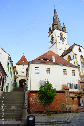 Obraz na płótnie Cityscape from the Old Town of Sibiu: Staircase Tower (Turnul Scărilor), old houses and the bell tower of the Cathedral of St. Mary. A journey through the most beautiful places in the Transylvania w salonie