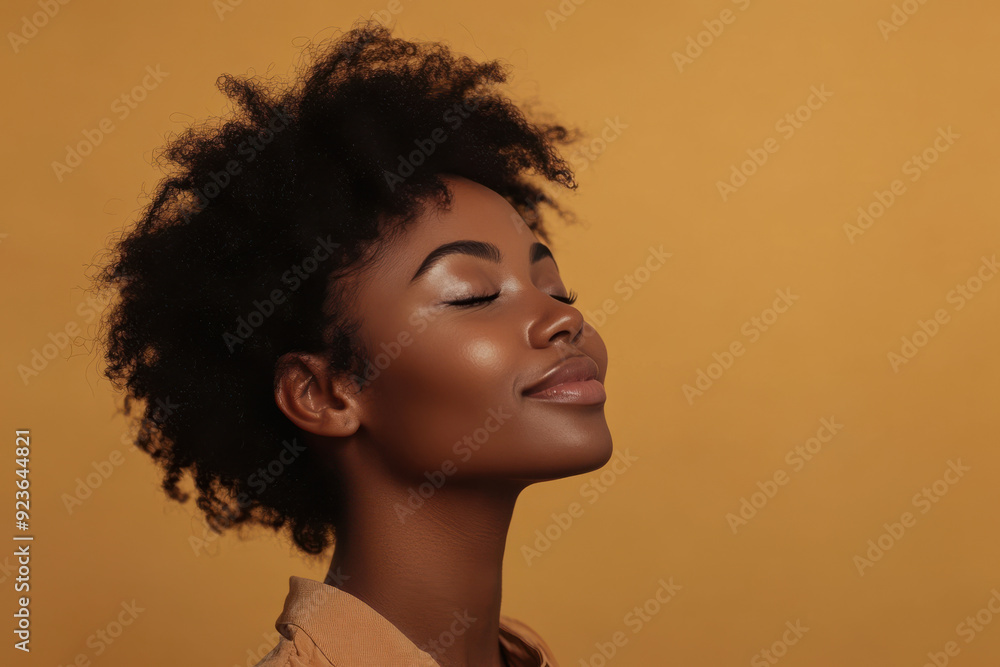 A close up of a black woman's face with her eyes closed