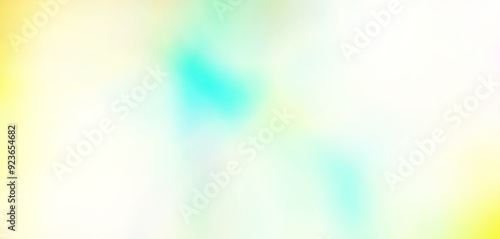 A blurred background featuring a blend of yellow, blue, and green hues