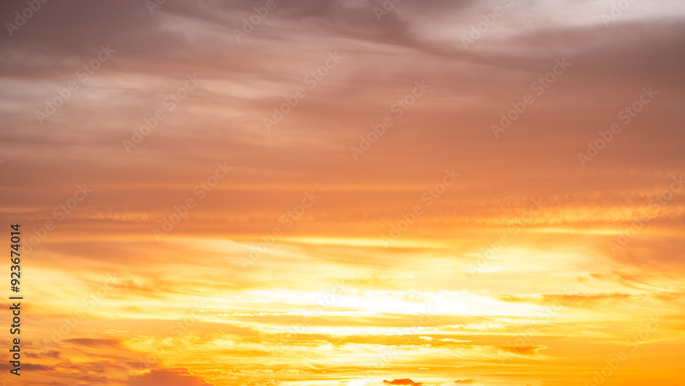 Beautiful , luxury soft gradient orange gold clouds and sunlight on the blue sky perfect for the background, take in everning,Twilight, Large size, high definition landscape photo Beautiful , luxury soft gradient orange gold clouds and sunlight on the blue sky perfect for the background, take in everning,Twilight, Large size, high definition landscape photo