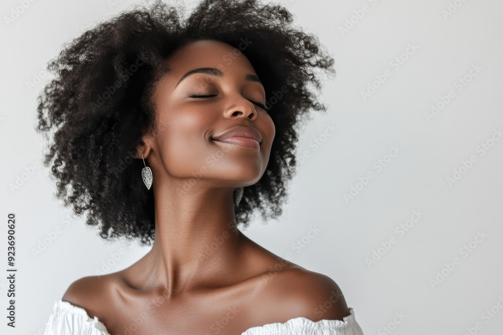 A close up of a black woman's face with her eyes closed A close up of a black woman's face with her eyes closed