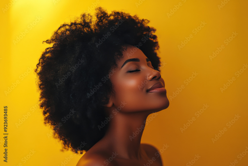 A close up of a black woman's face with her eyes closed A close up of a black woman's face with her eyes closed