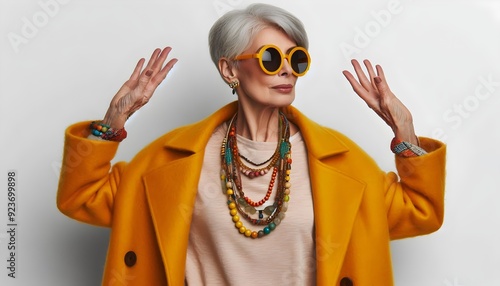 Stylish Elderly Woman in Coat with Matching Background Bold Fashion Statemen photo