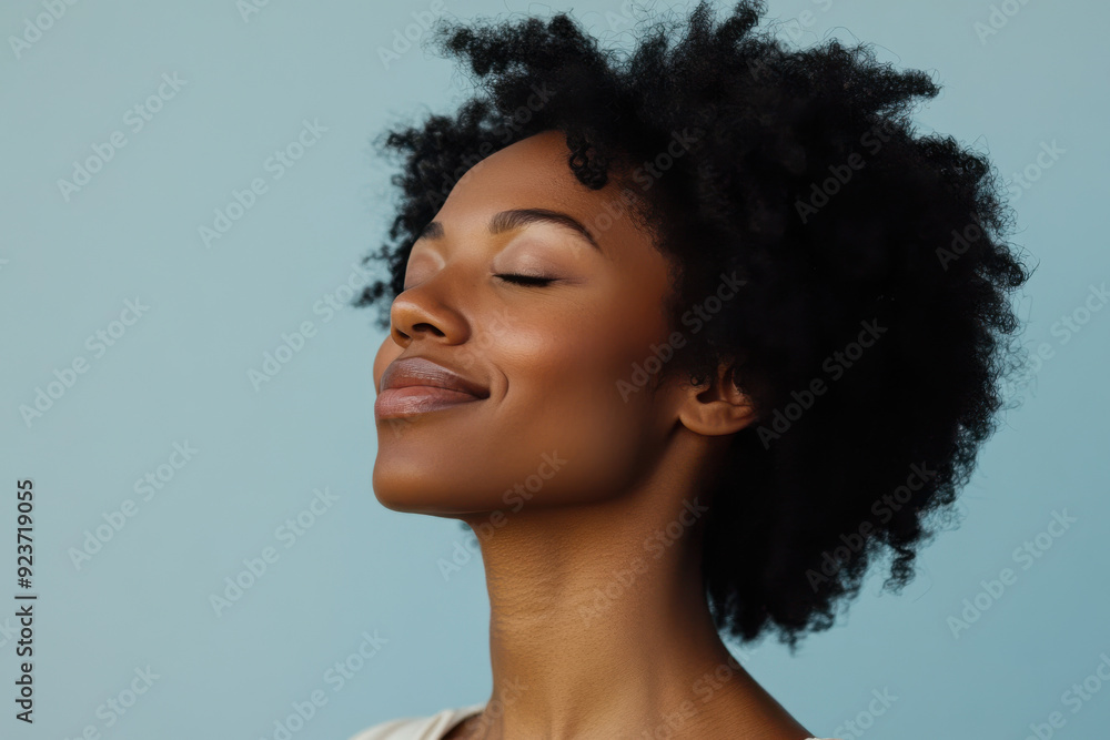 A close up of a black woman's face with her eyes closed A close up of a black woman's face with her eyes closed