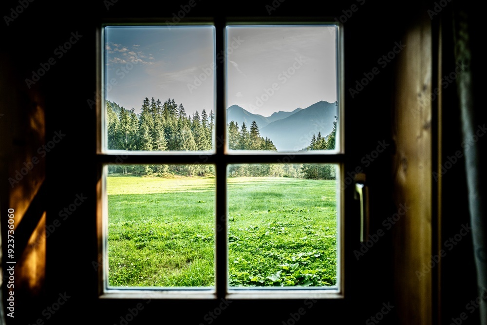 Naklejka premium View through a window of the Austrian Alps