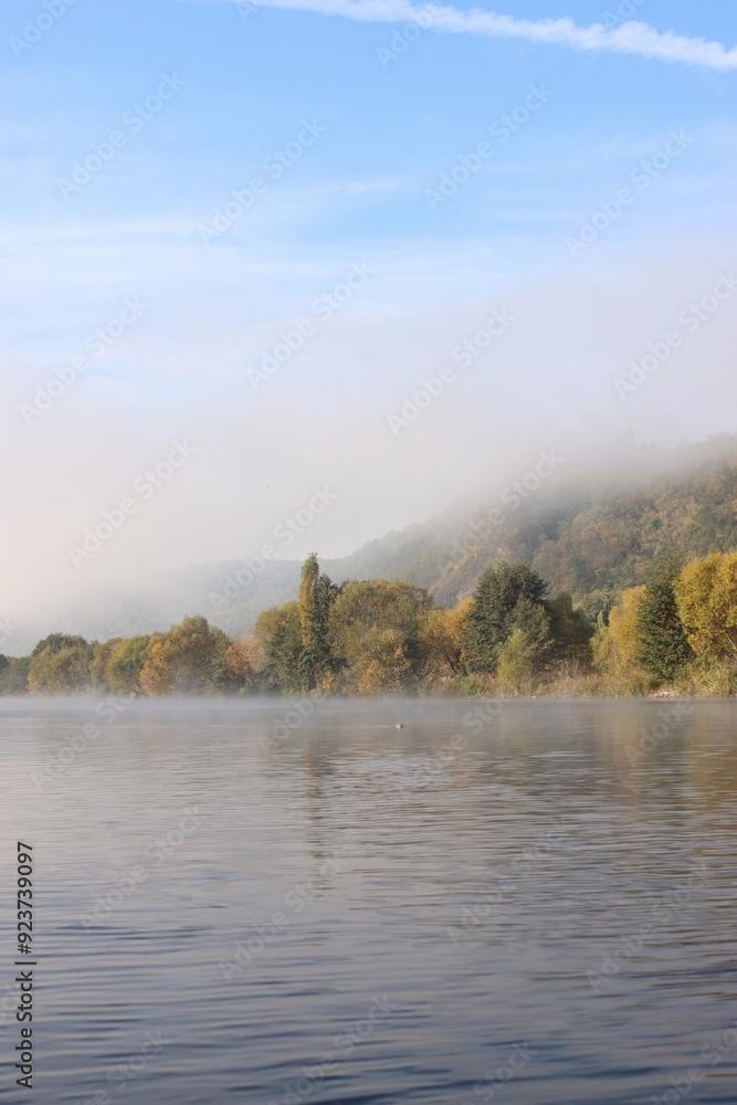 Fototapeta premium the fog reveals the hill on the river