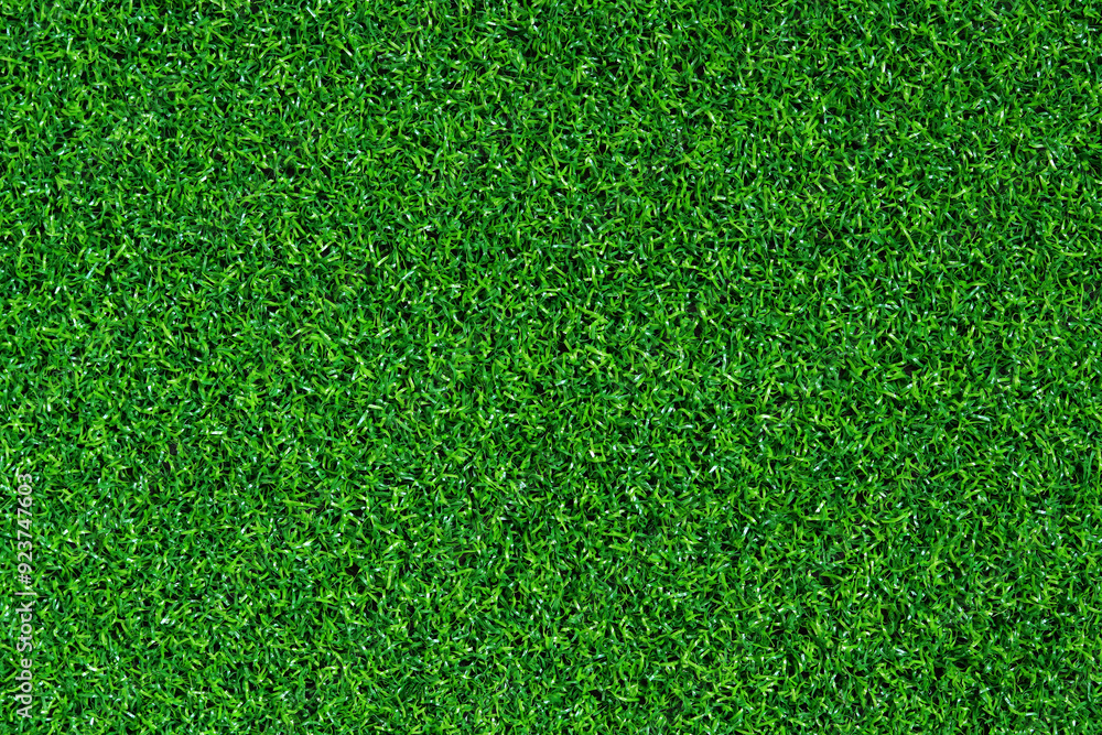 Fototapeta premium Artificial green grass mat, top view. Texture. Artificial turf, surface made of synthetic fibers. Flat green grass texture background. Short artificial grass golf surface