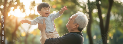 Asian grandson playing and laughing together with grandfather. Happy Asian family children having fun and playing with grandparents
