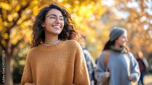 Autumn Stroll: Friends in Cozy Sweaters Enjoying a Walk in the Park