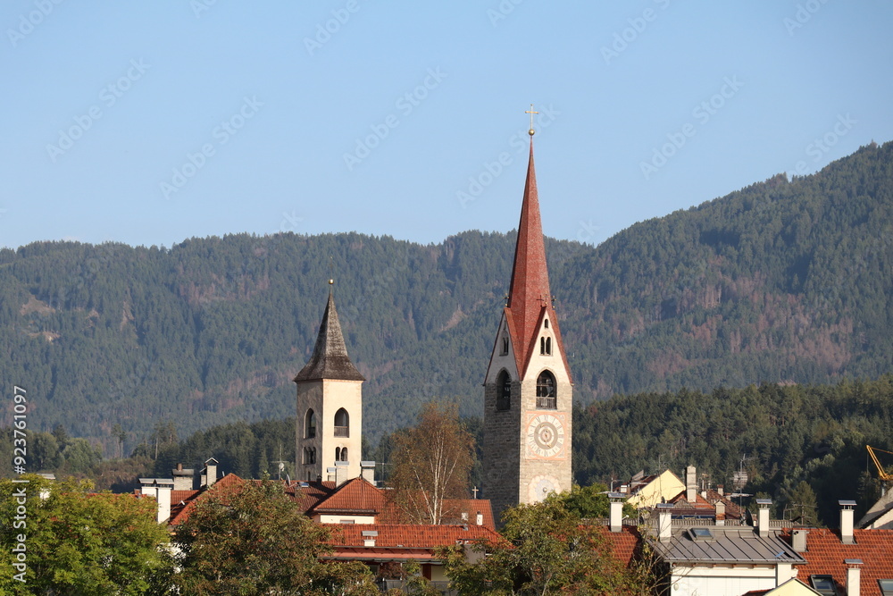 view of Sankt Lorenzen or San Lorenzen with the two spires and surrounded by mountains view of Sankt Lorenzen or San Lorenzen with the two spires and surrounded by mountains