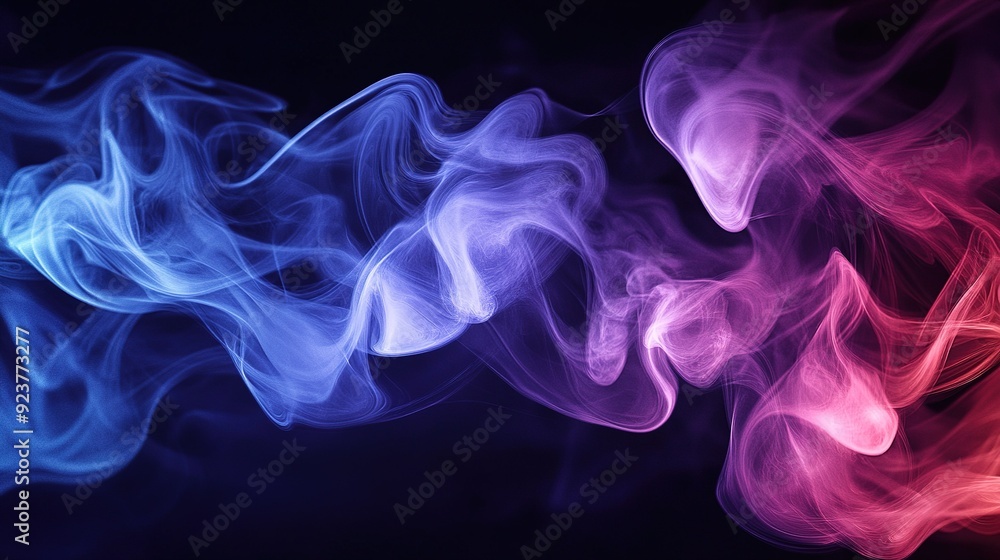 Colorful swirling smoke patterns in shades of blue and pink on a dark background