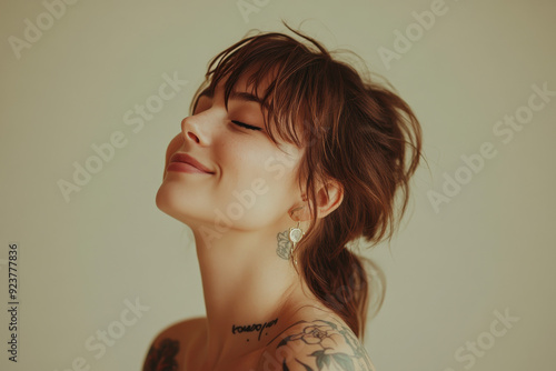 A close up of a woman's face with tattoos and her eyes closed