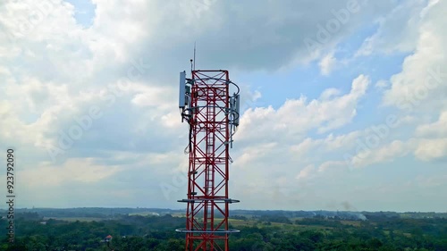 Aerial View 5G Telecommunication Towers Standing on Green Forest Beautiful Sky Rotating. Concept Communication Infrastructure. Telecom Tower Antenna and Satellite Transmits Signal Cellular Mobile 4k