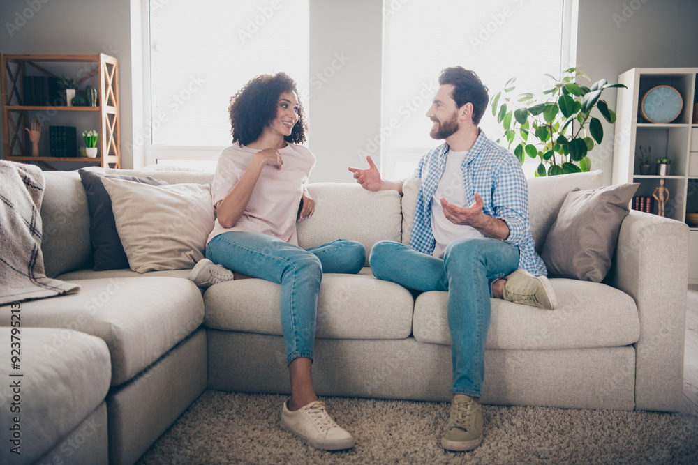 Photo of girl guy sit divan have talk say tell in domestic interior room Photo of girl guy sit divan have talk say tell in domestic interior room