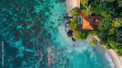 Aerial View of Secluded Tropical Villa with Private Pool and Surrounding Lush Foliage