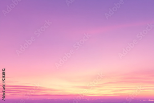 A panoramic photo captures the sky at sunset, with stunning shades of pink and purple blending seamlessly. photo