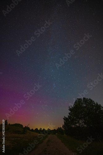 Long time exposure night landscape with Milky Way galaxy on the sky during the Meteor Shower Perseids. Shooting star.