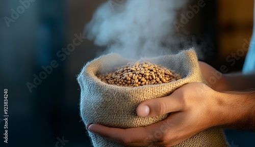 Close-Up of Hands Holding Coffee Beans in Jute Sack with Steam Rising from Surface