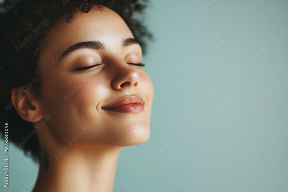 A close up of a woman's face with tattoos and her eyes closed A close up of a woman's face with tattoos and her eyes closed