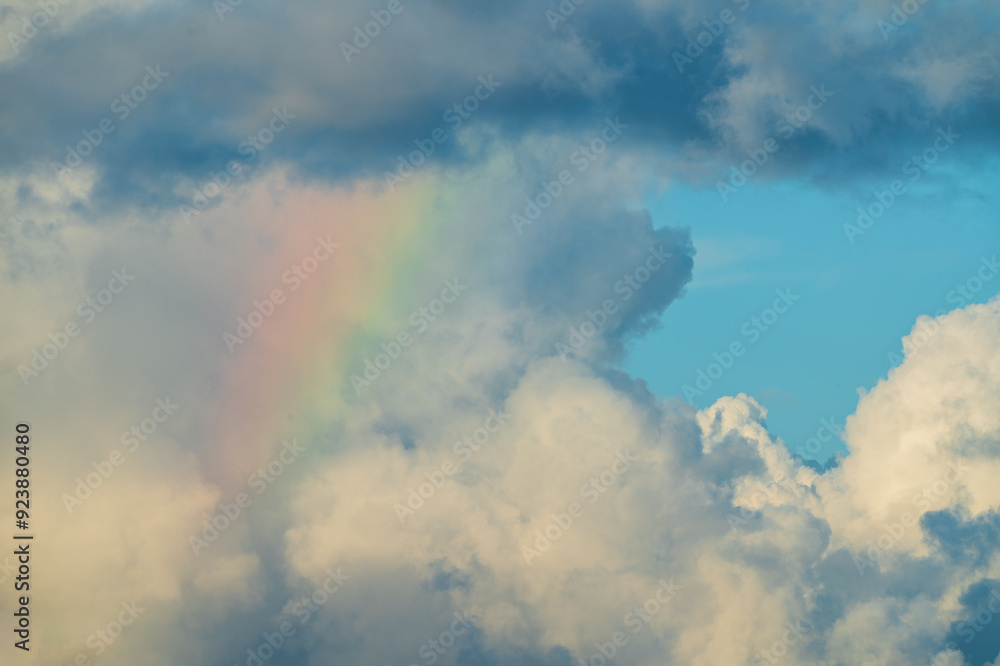 A stunning view of a stormy sky with a delicate rainbow peeking through the clouds. Vibrant rainbows create a dramatic and hopeful scene. Toucheng, Yilan City, Taiwan. A stunning view of a stormy sky with a delicate rainbow peeking through the clouds. Vibrant rainbows create a dramatic and hopeful scene. Toucheng, Yilan City, Taiwan.