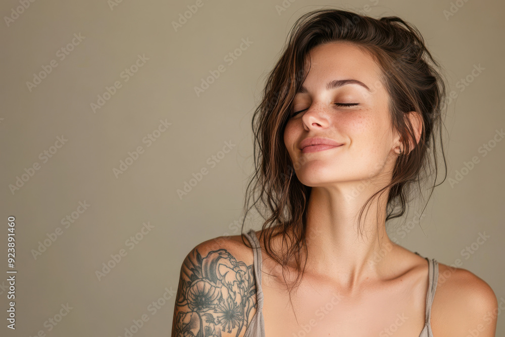 A close up of a woman's face with tattoos and her eyes closed A close up of a woman's face with tattoos and her eyes closed