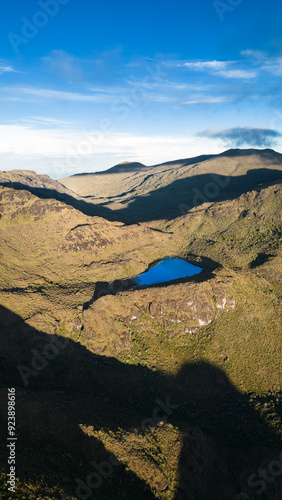 Aerial vertical shot of a landscape full of mountains and we stop at Lake Ditkevi on a beautiful morning in Chirripo National Park in Costa Rica photo