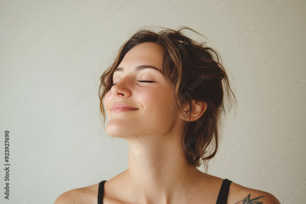 A close up of a woman's face with tattoos and her eyes closed A close up of a woman's face with tattoos and her eyes closed