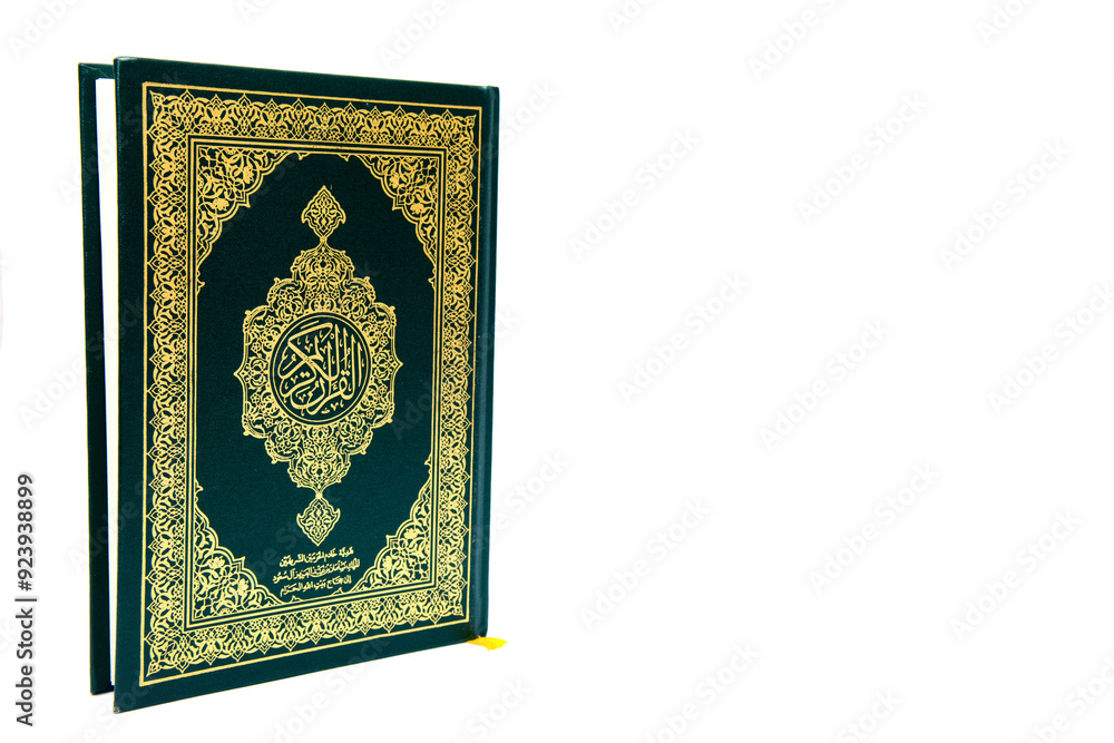 a hand pointing to the Muslim holy book al quran isolated on a white background with a hand pointing to the Muslim holy book al quran isolated on a white background with