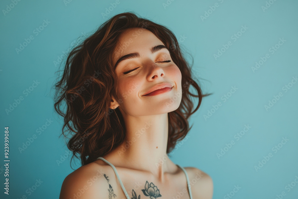 A close up of a woman's face with tattoos and her eyes closed A close up of a woman's face with tattoos and her eyes closed