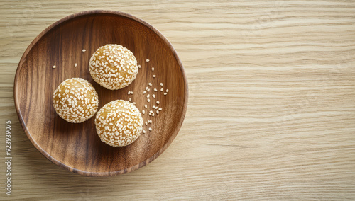 Chinese sesame seed balls traditional street food. Glutinous rice flour stuffed with mung bean paste coated with sesame seeds photo