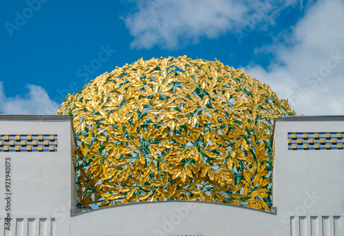 The golden dome of the historical jugenstil secession building in Vienna, Austria photo