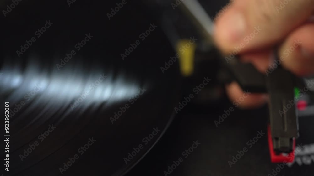 Turning on the gramophone with a vinyl disc. Turning on the gramophone with a vinyl disc.