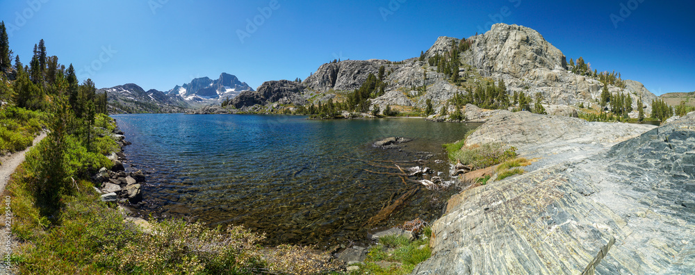 A beautiful lake surrounded by mountains A beautiful lake surrounded by mountains