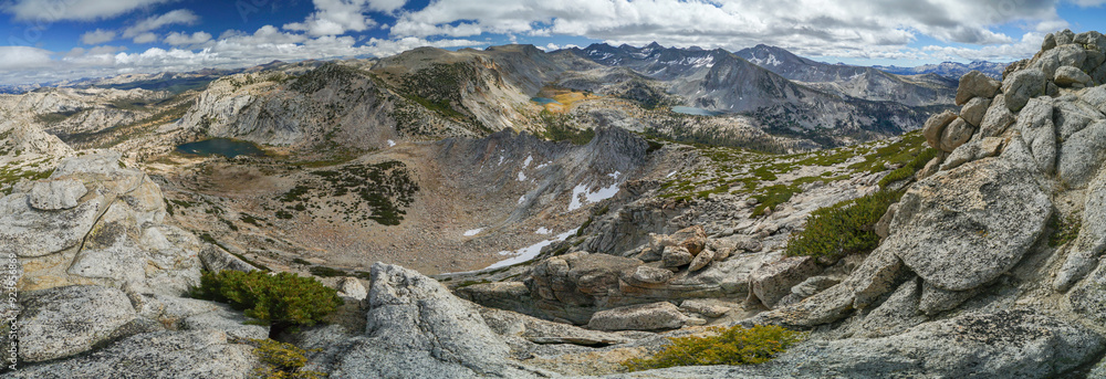 A panoramic view of a mountain range with a large crater in the middle A panoramic view of a mountain range with a large crater in the middle