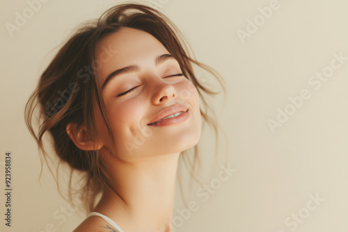 A close up of a woman's face with tattoos and her eyes closed