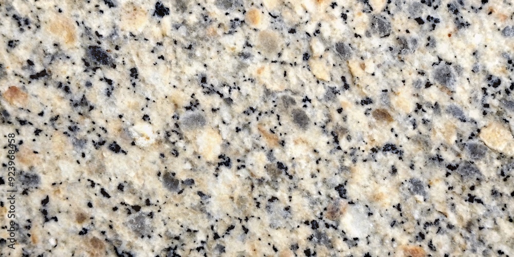 Natural Granite Texture - Warm Hues and Fine Grain. A closeup image of polished granite featuring a warm palette of beige, cream, and black in a fine-grained pattern. Ideal for backgrounds, textures. Natural Granite Texture - Warm Hues and Fine Grain. A closeup image of polished granite featuring a warm palette of beige, cream, and black in a fine-grained pattern. Ideal for backgrounds, textures.