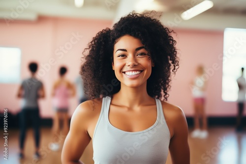 Diverse collection of individuals from different cultures working out in fitness studio. Smiling people from various cultural communities come to exercise in fitness studio showing diversity photo