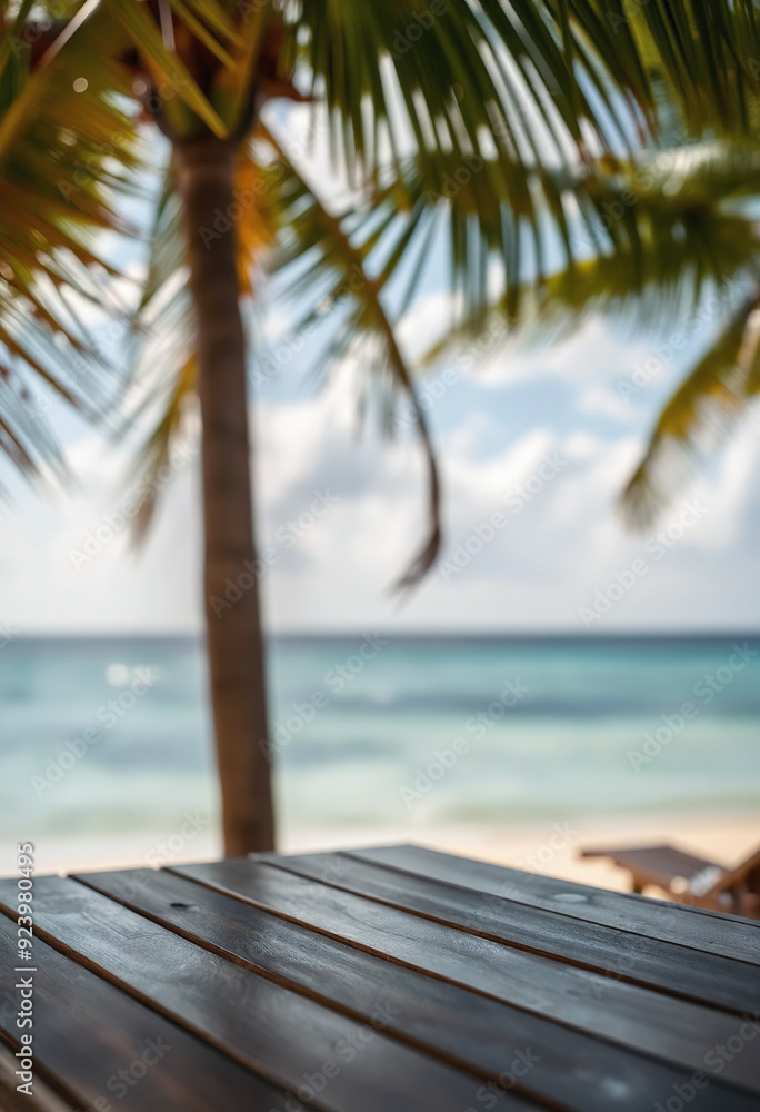 Fototapeta premium Top of wood table with seascape and palm tree, blur bokeh light of calm sea and sky at tropical beach background